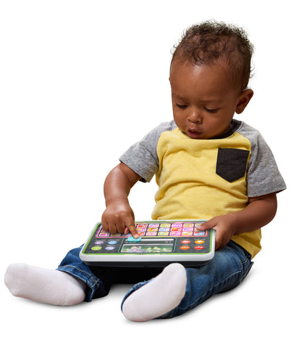Leapfrog My First ABC Tablet with colorful buttons held by toddler