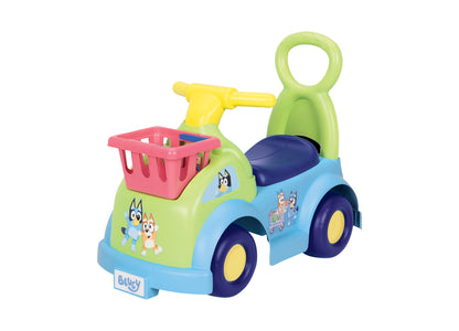 Bluey Shopping Cart Ride-On toy in blue, green and yellow with pink basket