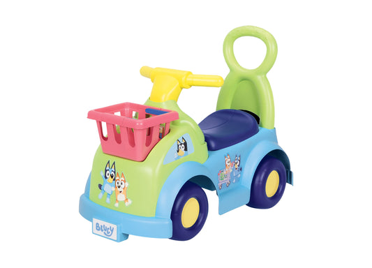 Bluey Shopping Cart Ride-On toy in blue, green and yellow with pink basket