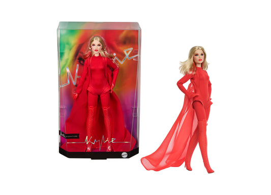 Barbie Signature Kylie Minogue doll in red bodysuit with flowing cape, shown in packaging and on model