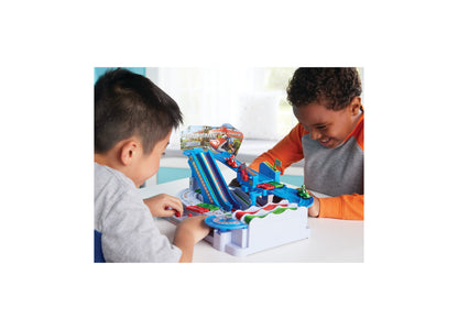 Two children playing with Super Mario Kart Racing Obstacle Course Track set with blue ramp and colorful race cars