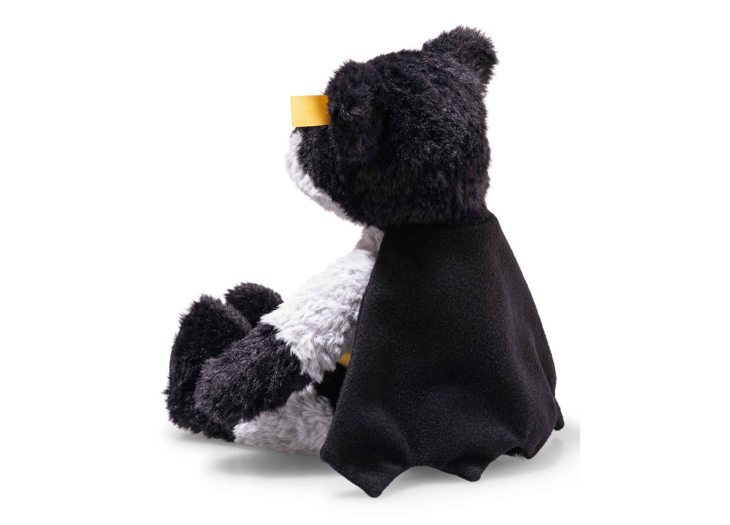 Steiff DC Batman 12 inch teddy bear with black fur, white chest, and yellow cape collar