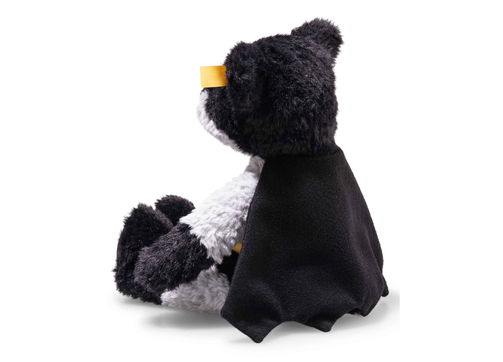 Steiff DC Batman 12 inch teddy bear with black fur, white chest, and yellow cape collar