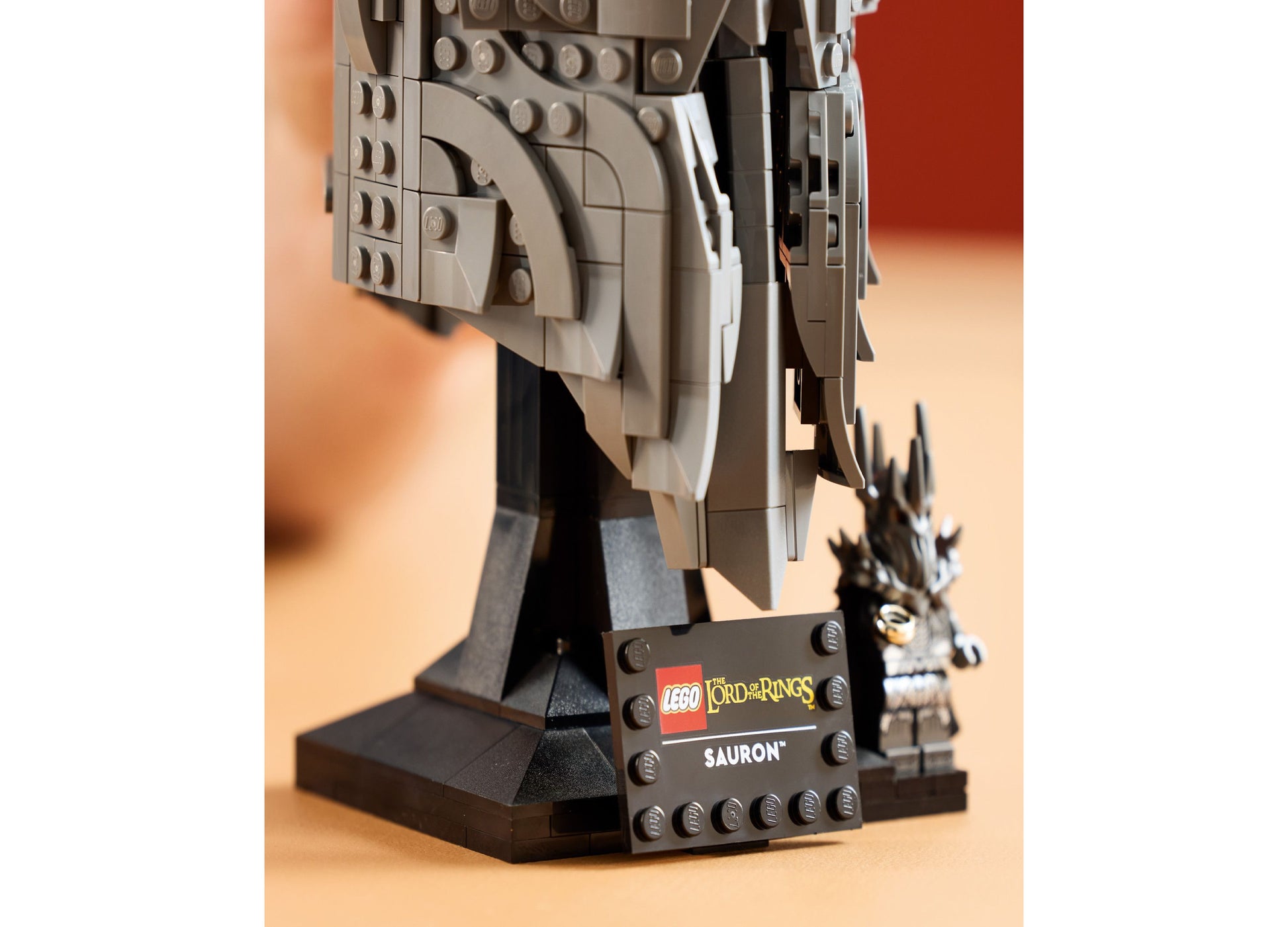 LEGO Icons Sauron's Helmet Display Model Kit with minifigure on tan background