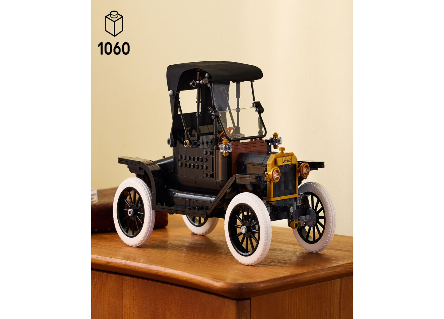 LEGO Icons Ford Model T vintage car building set with black body, yellow engine, and white wheels on wooden display base