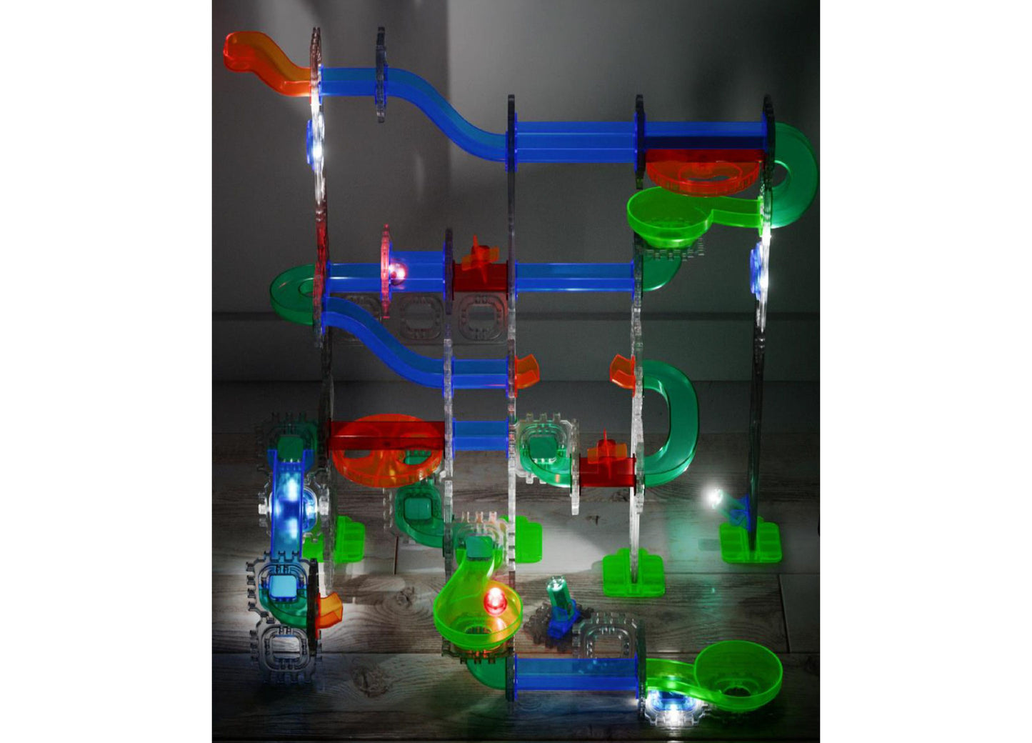 Discovery Kids MINDBLOWN Glow Roll Marble Run with glowing blue tracks, green and red pieces, and LED lights