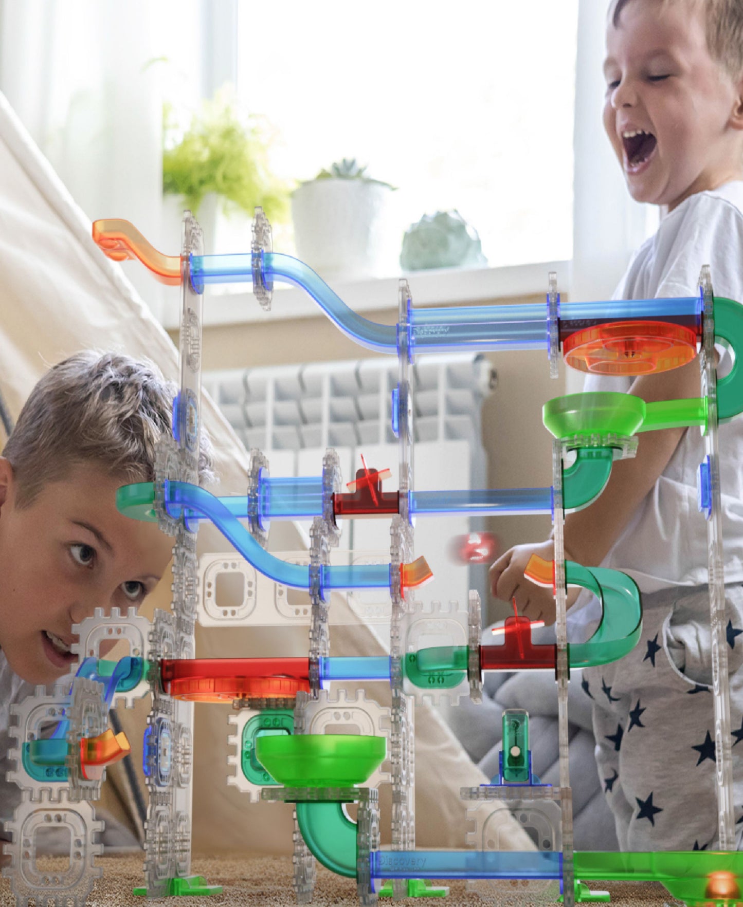 Discovery Kids MINDBLOWN Glow Roll Marble Run with light-up tracks, green and blue pieces