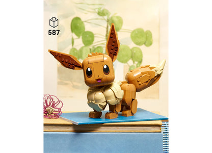 LEGO Pokémon Eevee Building Set with 587 pieces, featuring tan and brown brick-built Eevee character with posable ear...
