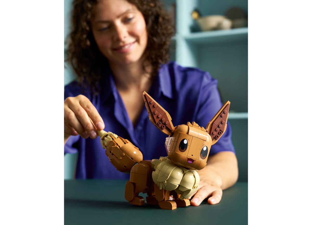 LEGO Pokémon Eevee Building Set with tan and brown bricks, featuring large expressive eyes and pointed ears