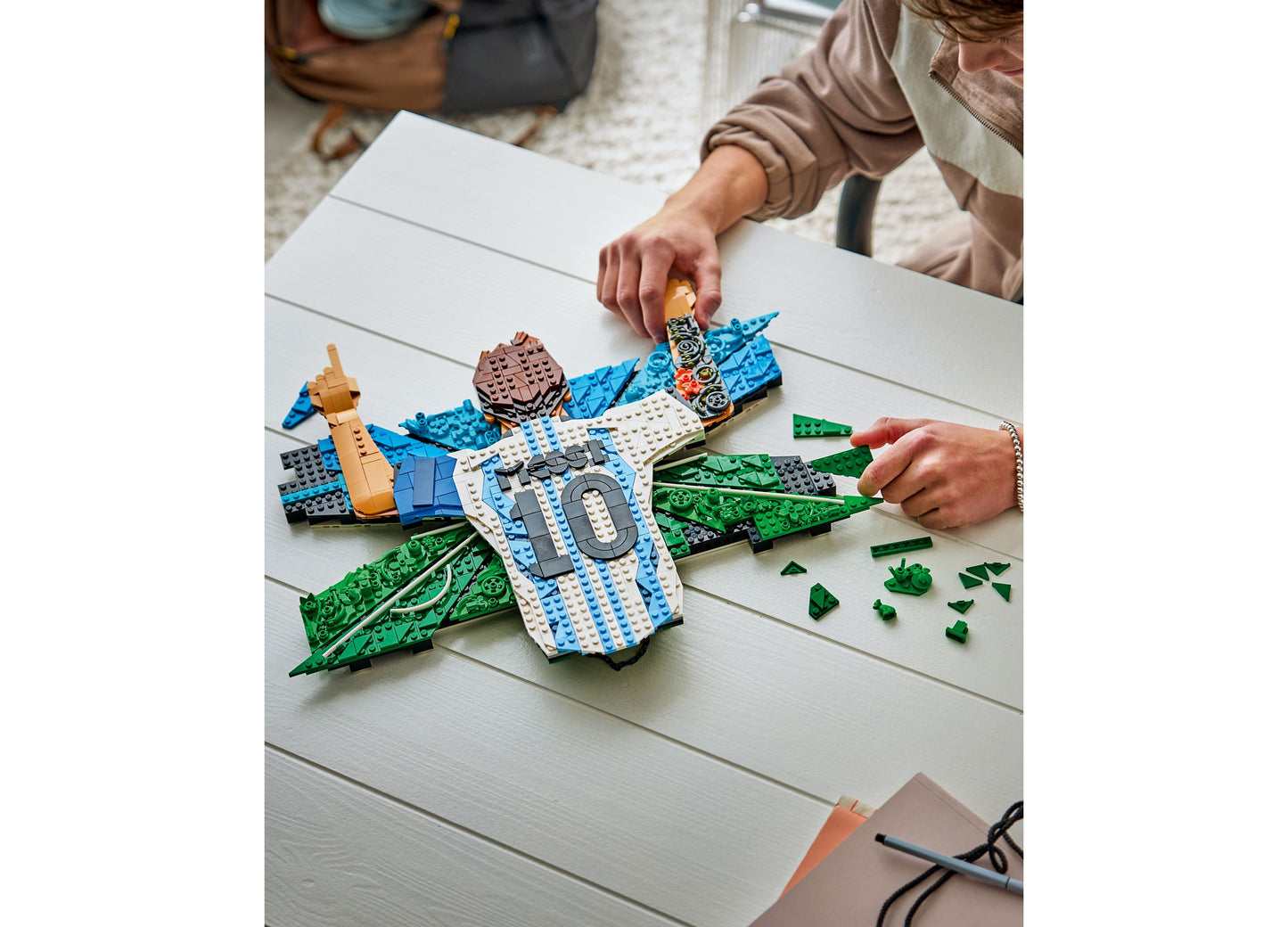 LEGO Editions Lionel Messi Celebration Building Toy 43018 with blue, white, and green pieces being assembled