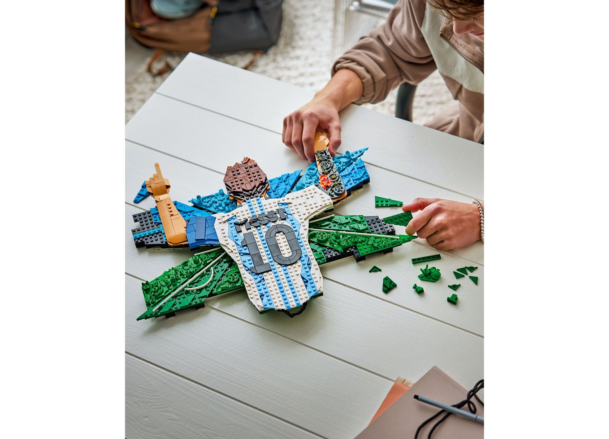 LEGO Editions Lionel Messi Celebration Building Toy 43018 with blue, white, and green pieces being assembled
