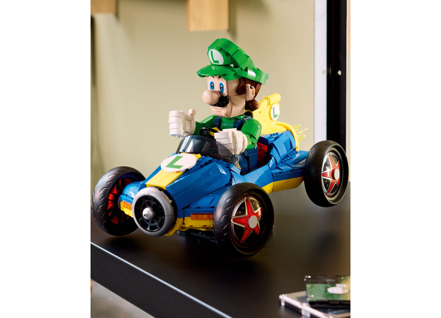 LEGO Mario Kart Luigi Mach 8 blue and yellow race car with green Luigi minifigure driver