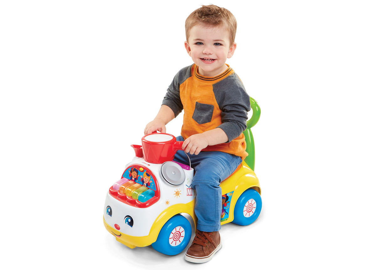 Fisher-Price Little People Music Parade Ride-On with lights and sounds in yellow, blue, and white