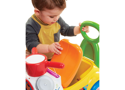 Fisher-Price Little People Music Parade Ride-On with colorful drum, trumpet, and cymbal instruments in red, orange, y...