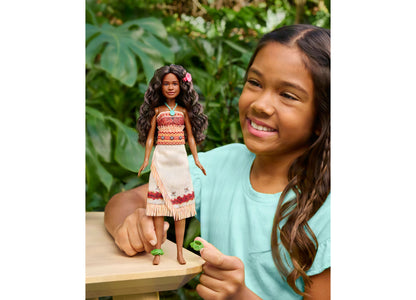 Disney Princess Moana Fashion Doll with removable outfit, accessories, and long dark hair with flower