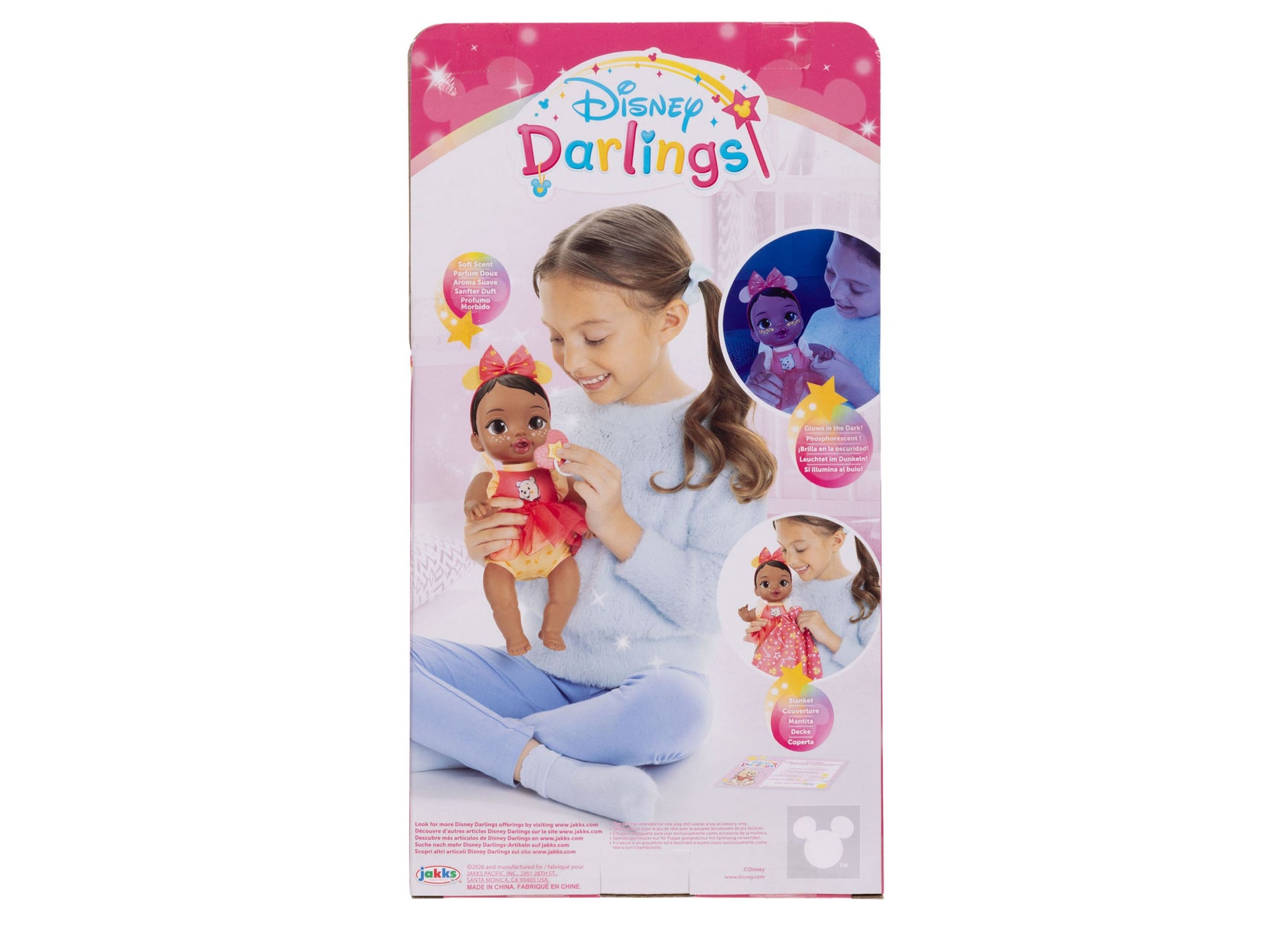 Disney Darlings Snuggly Stars baby doll with pink outfit and bow headband in packaging