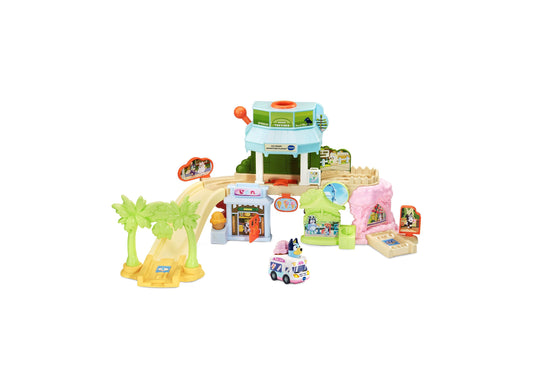 Bluey Ice Cream Adventure Playset with colorful buildings, palm tree, ice cream truck, and interactive SmartPoint fea...