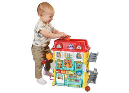 VTech Up & Down Activity Town colorful interactive learning center with red roof, toddler playing