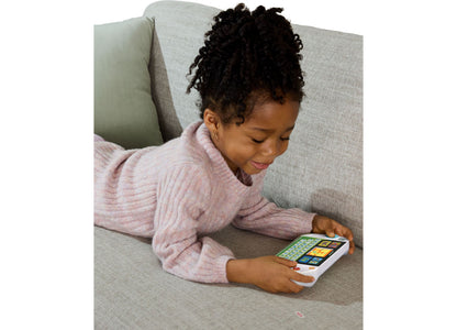 LeapFrog My First Gamer toy with colorful game buttons held by child on couch