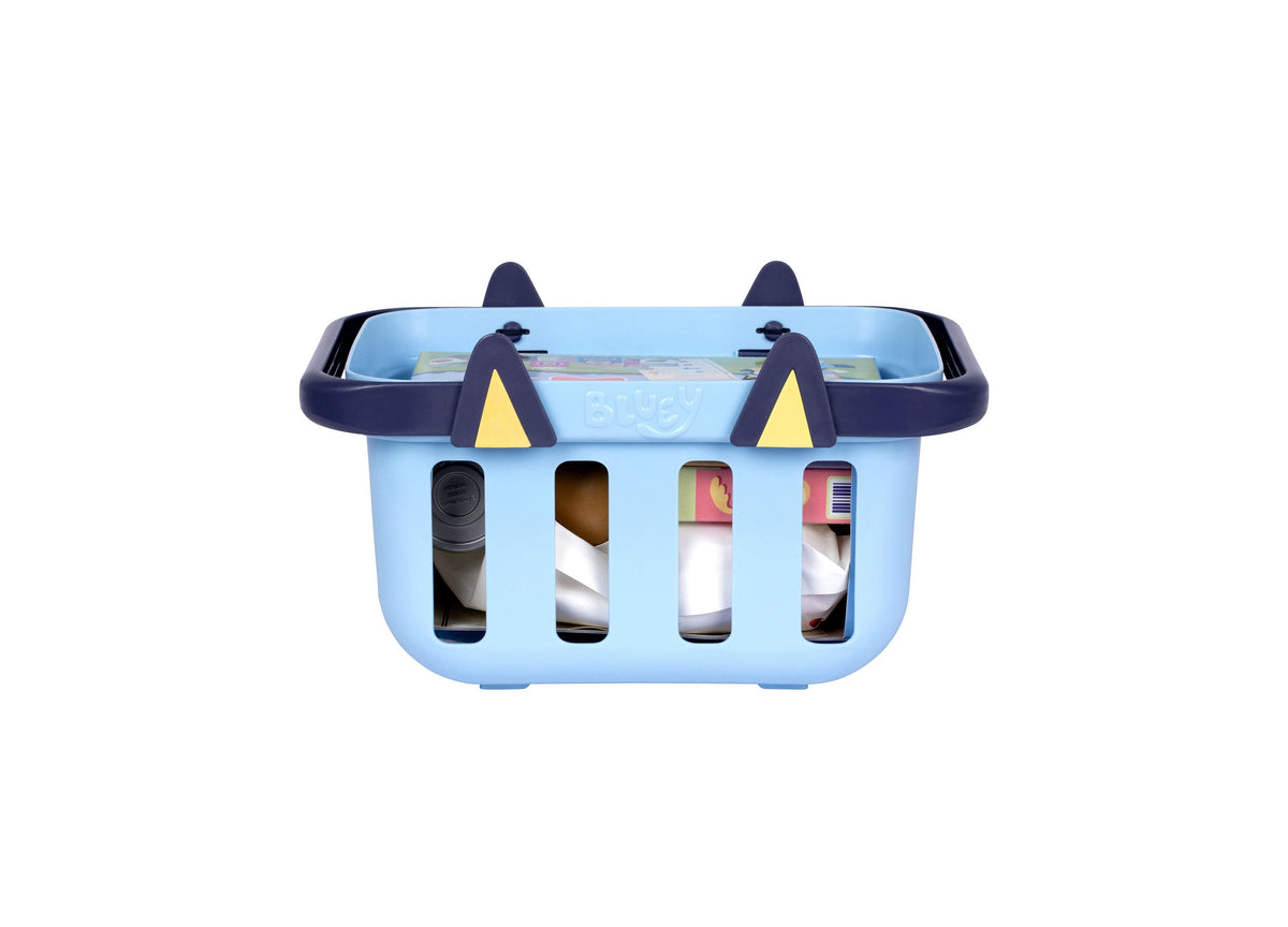 Bluey Shopping Basket playset in light blue with dark blue handles and ear details, featuring four window cutouts dis...