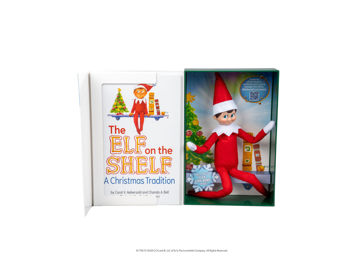 Elf on the Shelf Scout Elf Boy figure with red suit and hat next to storybook in boxed set