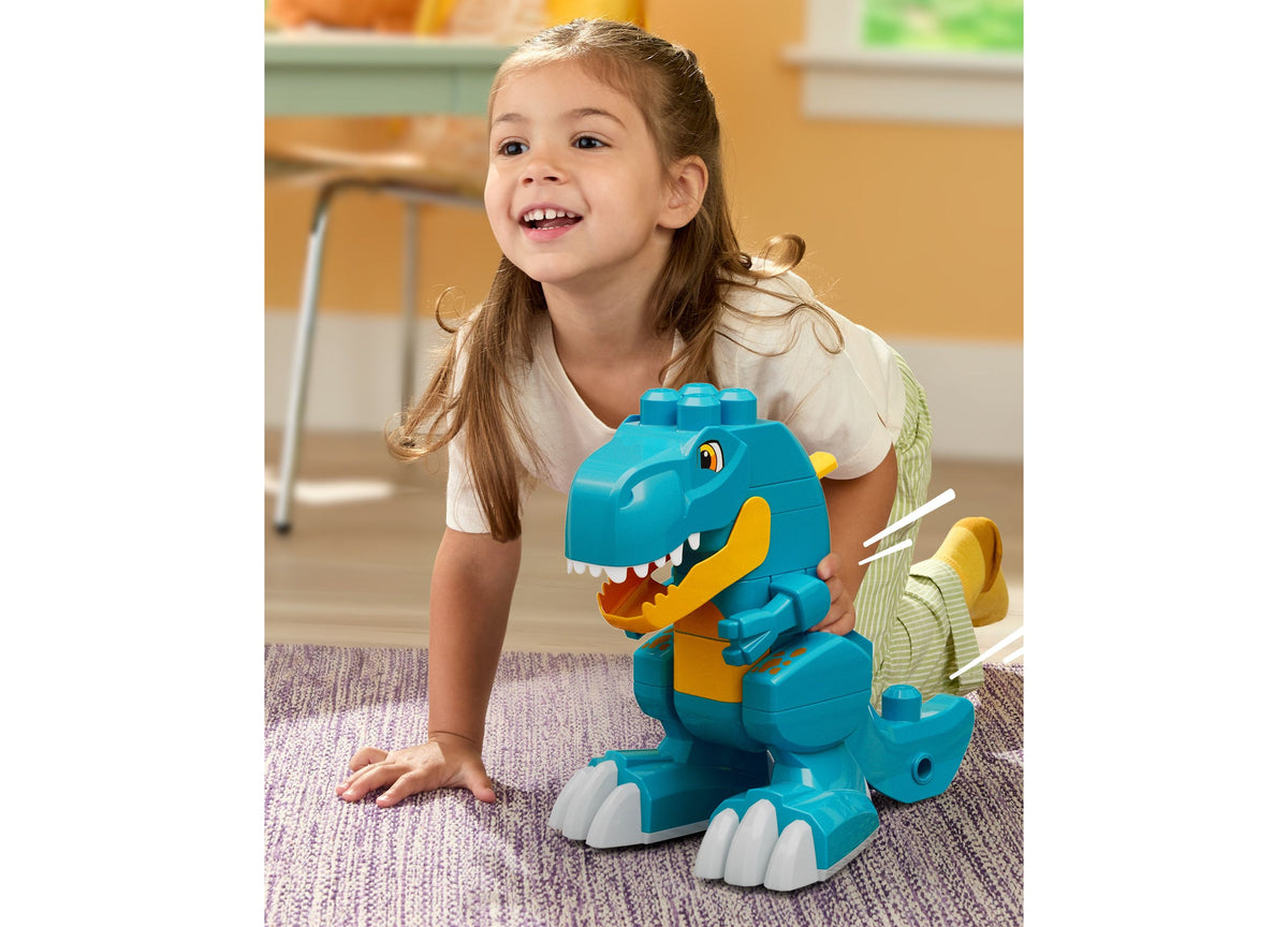 Mega Bloks Fisher-Price Build & Chomp Dinosaur set with turquoise and yellow T-Rex dinosaur toy with opening mouth
