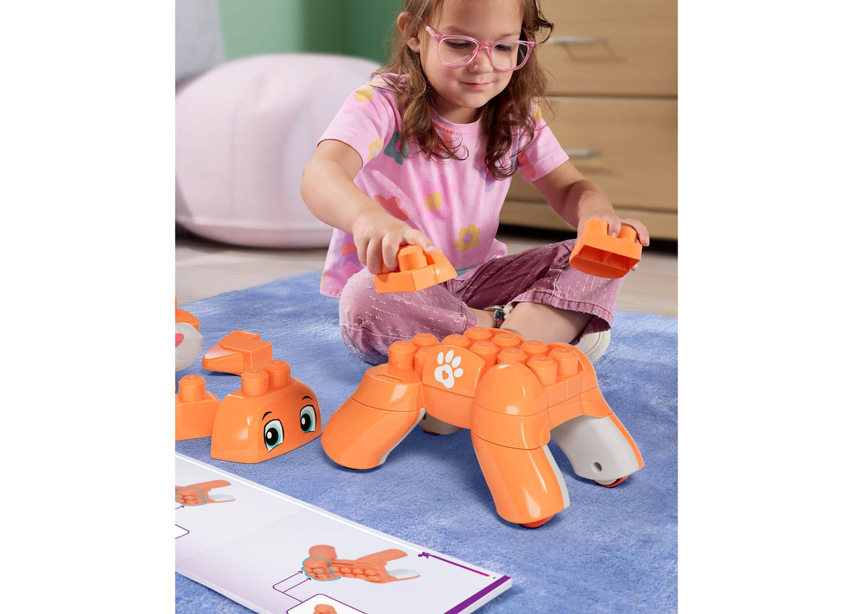 Mega Bloks Fisher-Price Rolling Kitten 3-in-1 25-Piece Building Set in orange with child building kitten figure