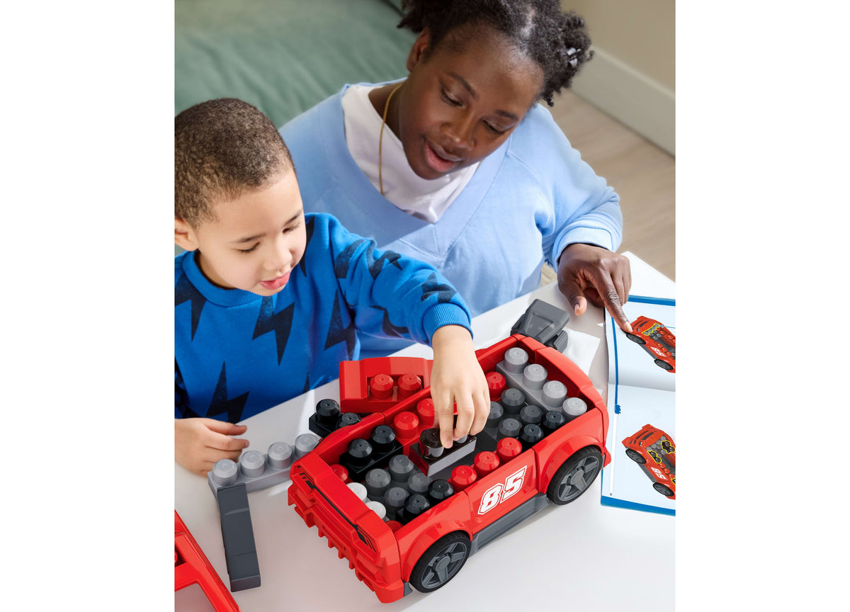 Mega Bloks Build & Go 3-in-1 Race Car 26-Piece Building Set in red with child and caregiver building together
