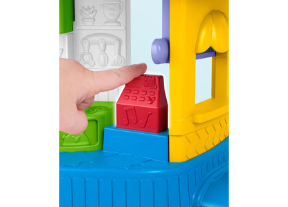 Fisher Price Mickey Goofy Silly Sounds Diner Playset with colorful blocks and child's hand