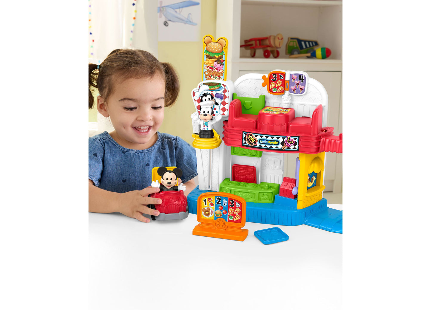Fisher Price Mickey and Goofy Silly Sounds Diner Playset with colorful red, yellow, and blue pieces