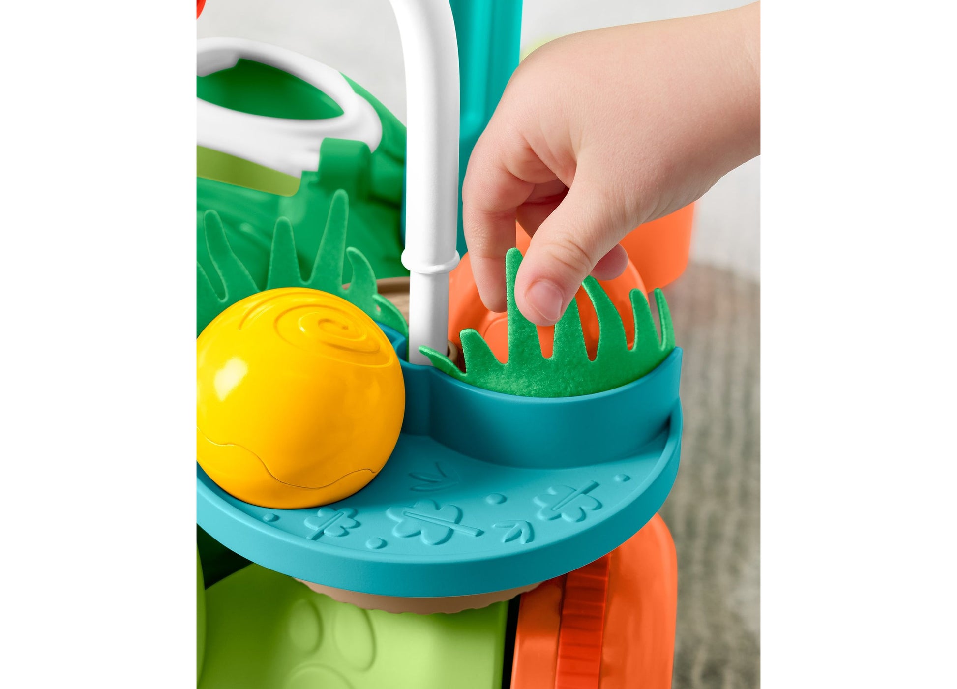 Fisher Price Turtle Walker with yellow ball and green grass feature, teal and orange colors