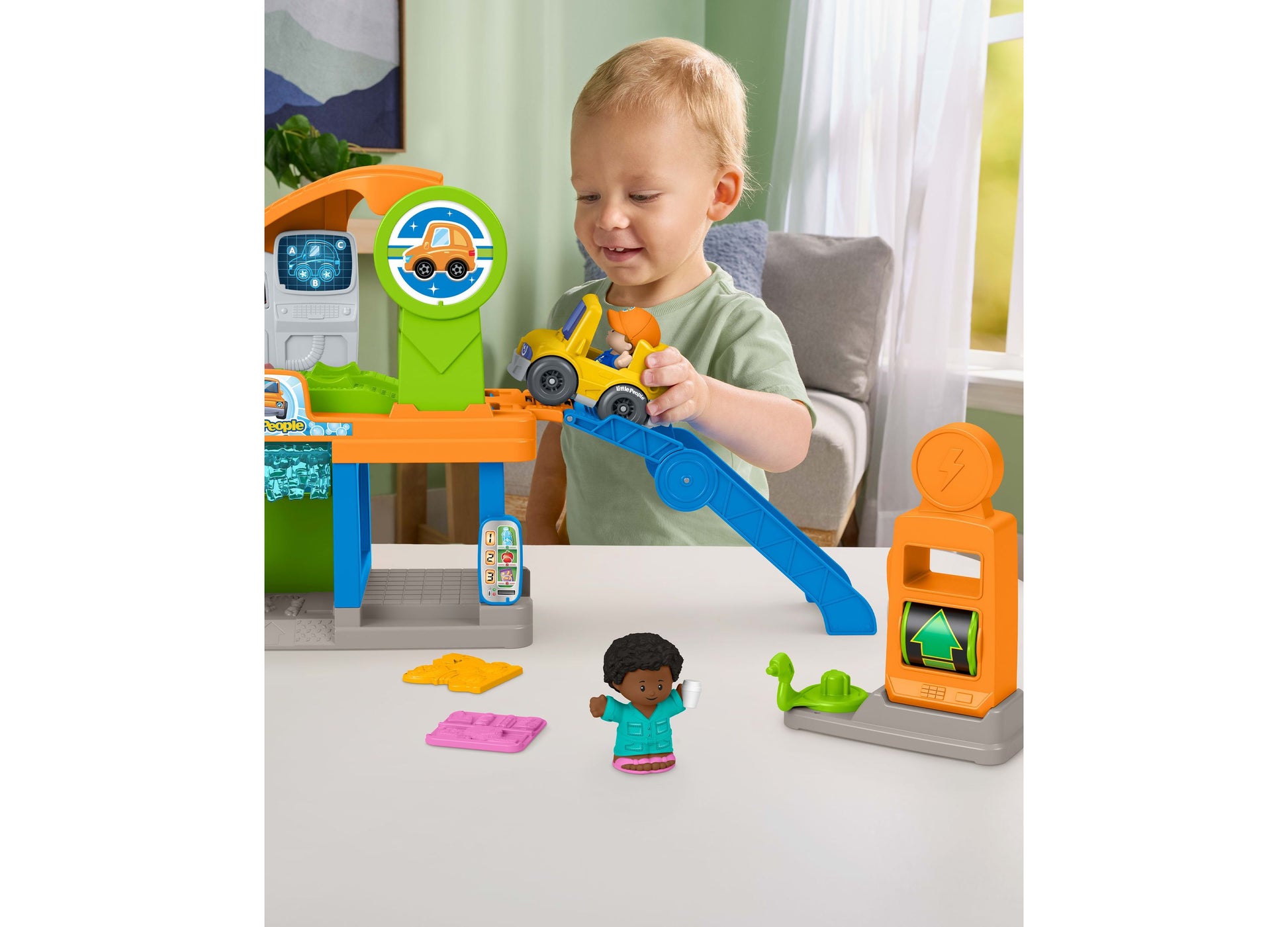 Fisher Price Little People Service Station playset with blue ramp, yellow truck, and figure