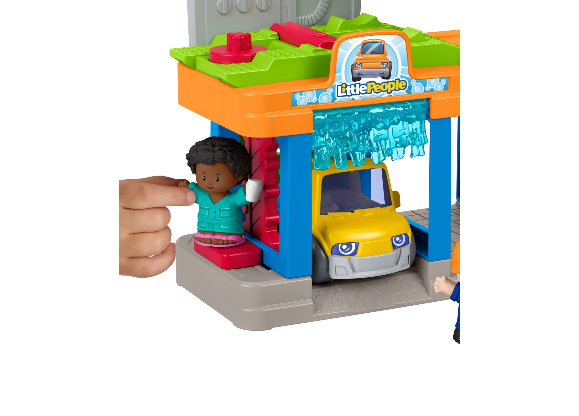 Fisher Price Little People Service Station playset with yellow car, figure, and colorful ramp in green, orange, and blue