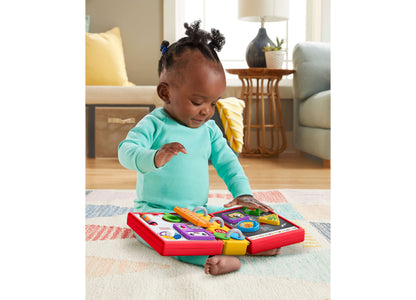 Fisher Price Laugh and Learn 123 Schoolbook interactive book with colorful buttons, baby playing on floor