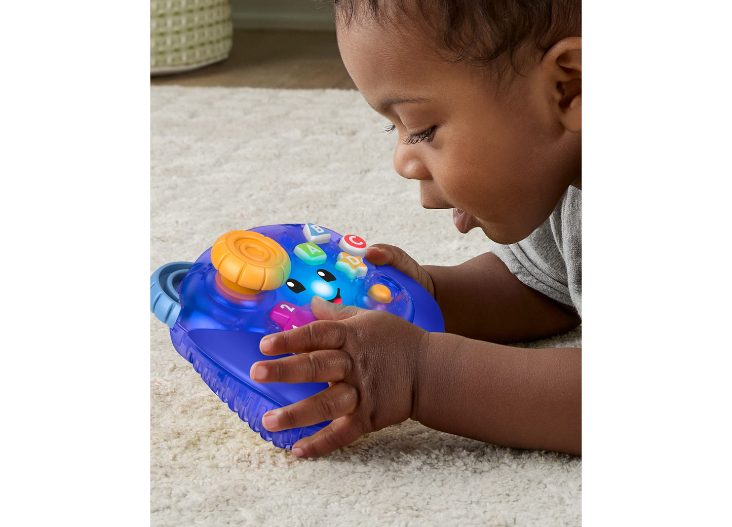 Fisher Price Laugh and Learn Controller with baby playing, blue toy with orange and colorful buttons