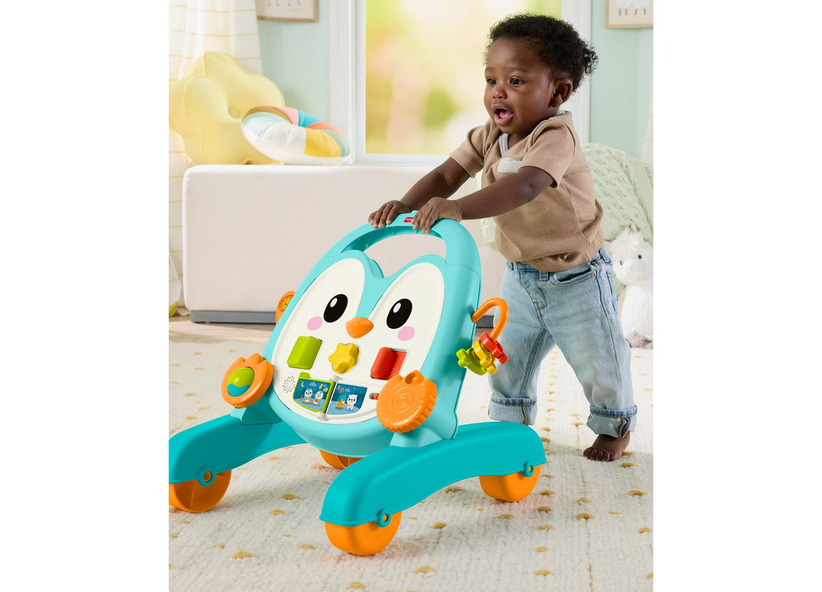 Fisher-Price 2-in-1 Musical Penguin Activity Walker in turquoise and orange with baby playing