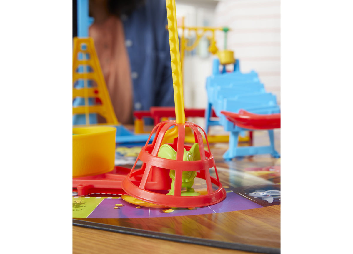 Mouse Trap board game with red cage trap and yellow pole on colorful game board