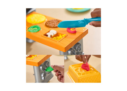 Play-Doh Super Sizzlin' Kitchen Playset with orange stovetop, blue knife, pasta maker, and colorful pretend foods