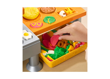 Play-Doh Super Sizzlin' Kitchen Playset with colorful pretend foods including red tomato, green lettuce, and yellow p...