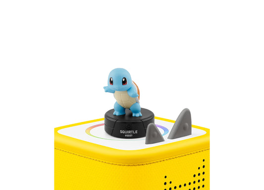 Tonies Pokémon Squirtle audio figurine on yellow Toniebox speaker with gray fins