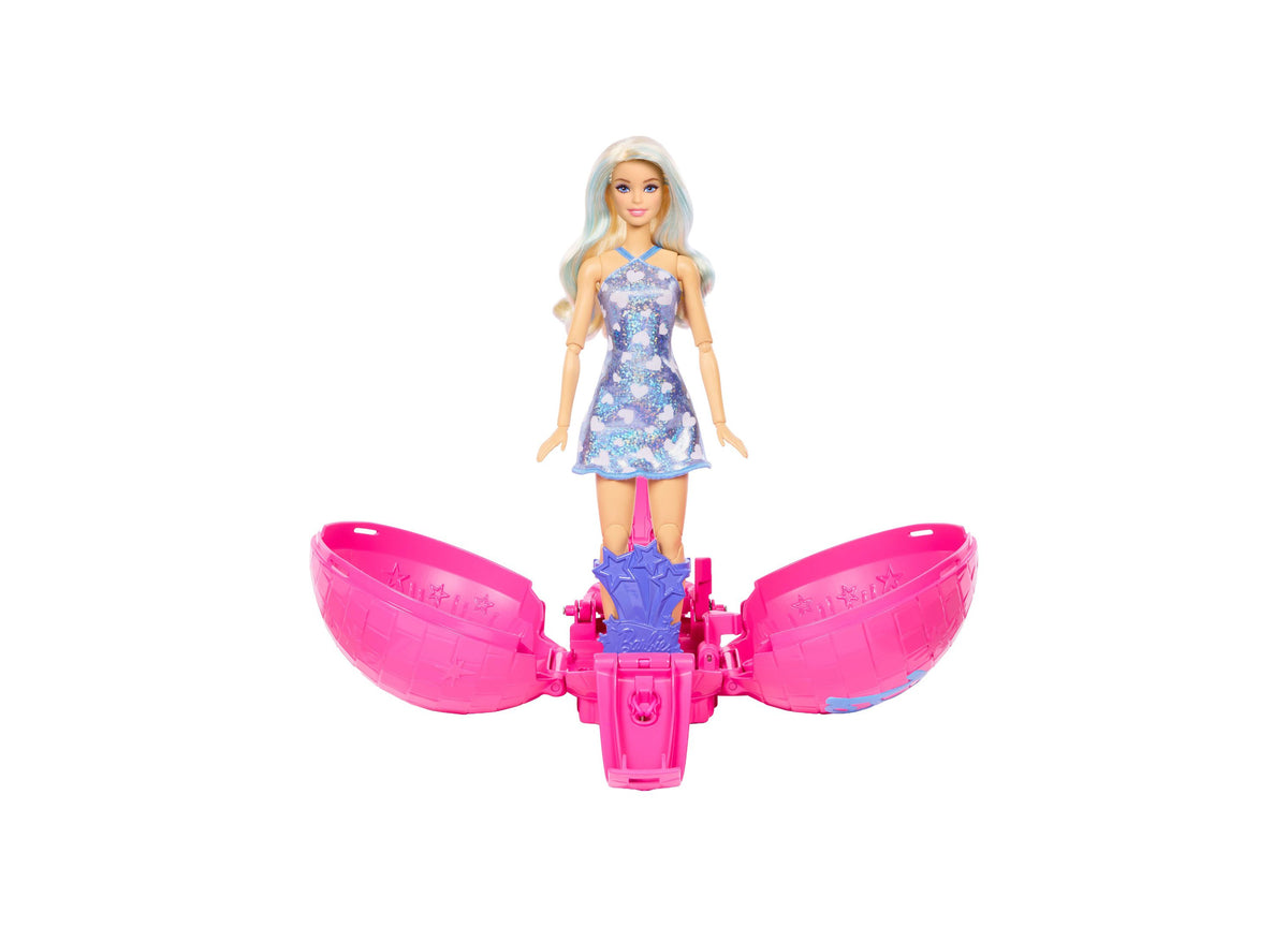 Barbie Roll & Reveal Pop Star doll with light blue hair in purple sequin dress, standing on pink rolling ball toy base
