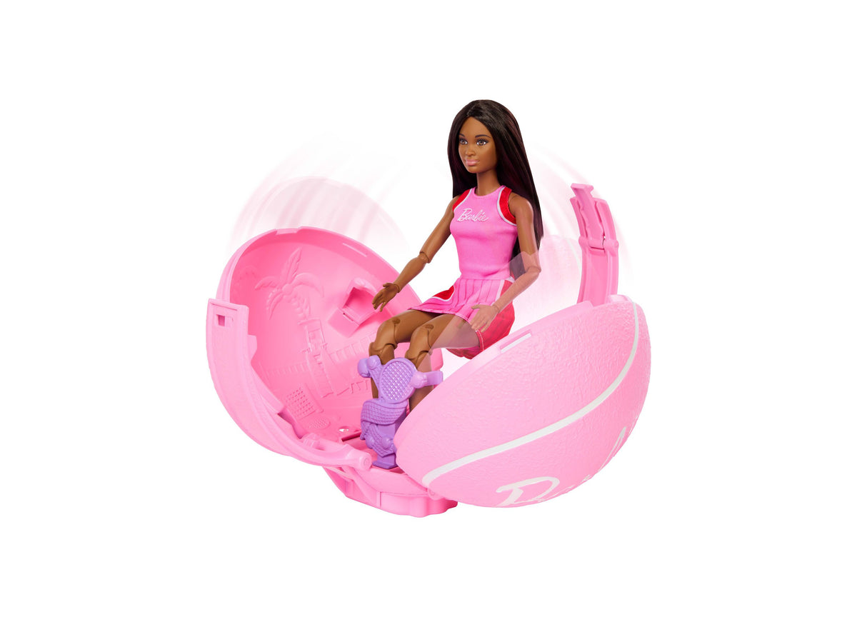 Barbie Team Barbie Roll & Reveal Tennis Player brunette doll in pink tennis outfit with pink ball-activated scene