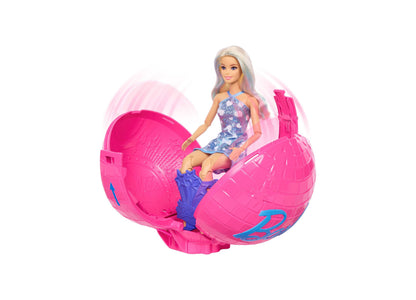 Barbie Roll & Reveal Pop Star doll in blue sequin dress sitting in pink spherical ball with blue accents