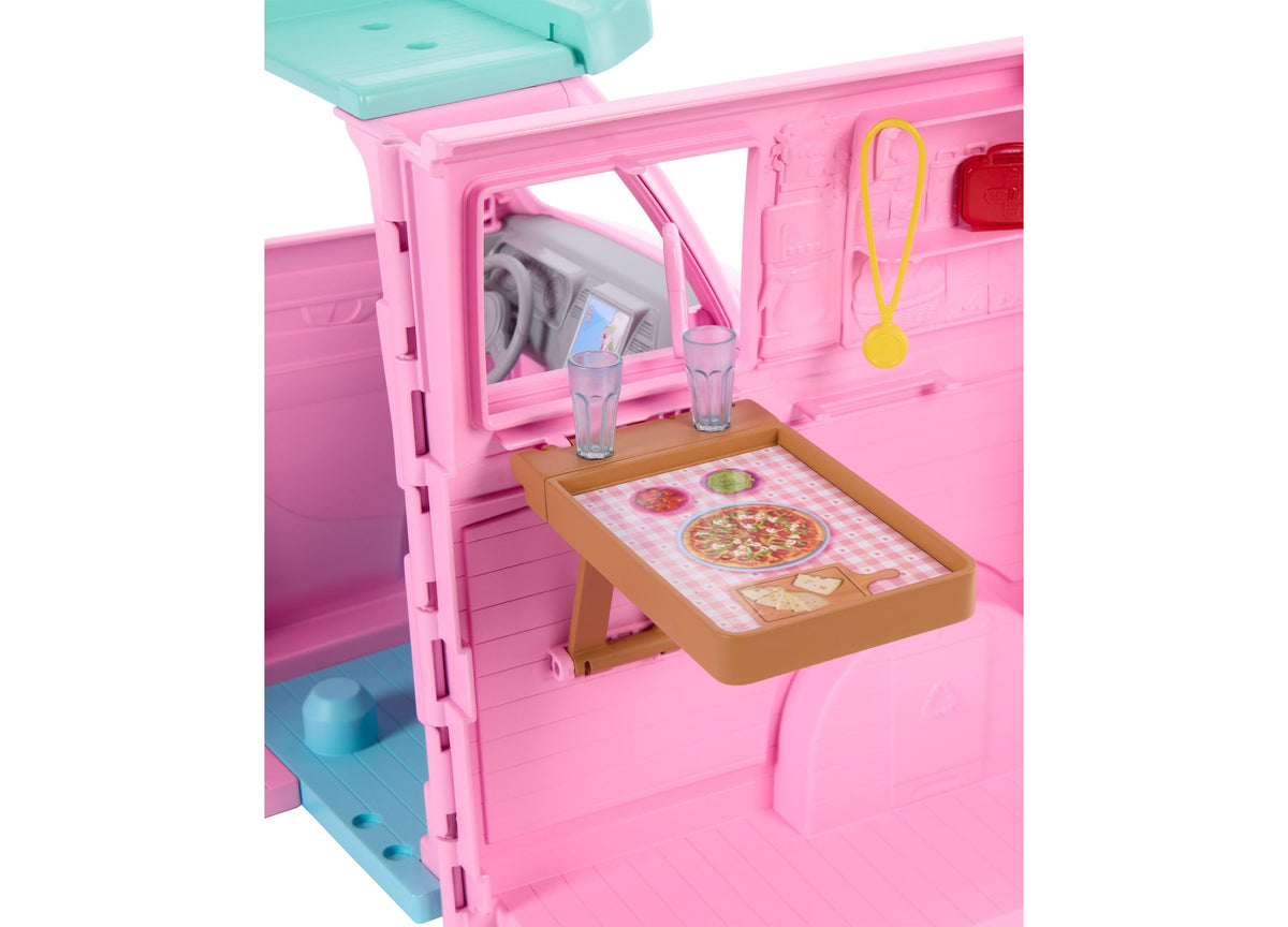 Barbie Dream Land Road Trip Camper playset in pink with open kitchen window, dropdown table with pizza design, and tw...