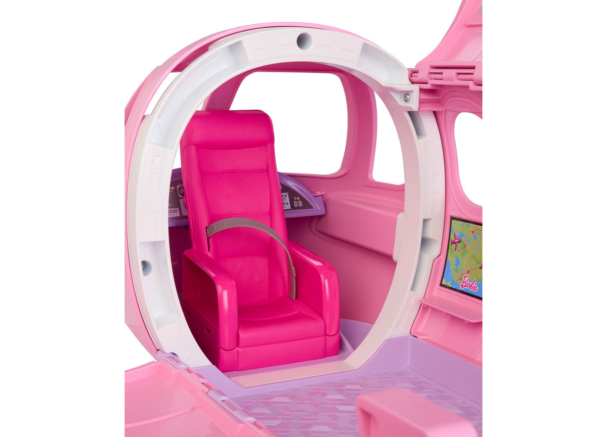 Barbie Dream Plane 15-Piece Airplane Playset with pink airplane interior, hot pink pilot seat, and control panel visible