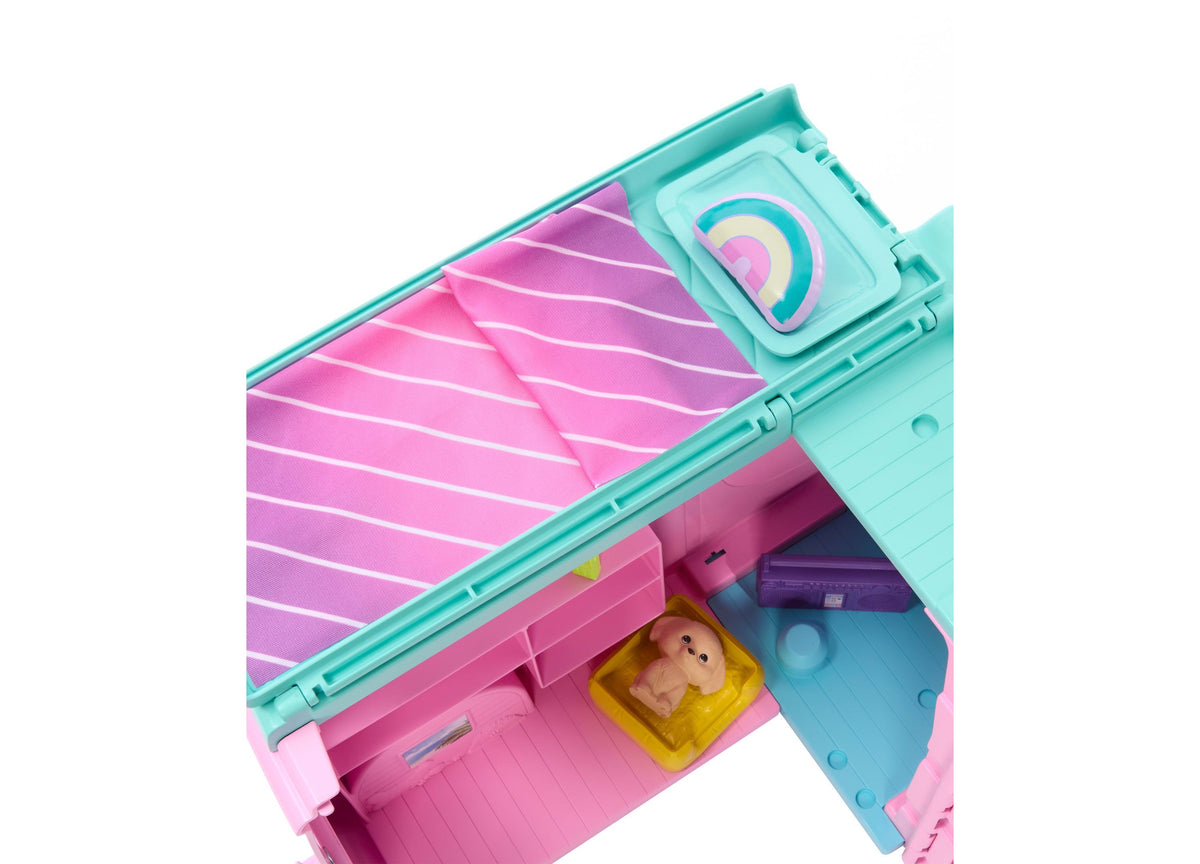 Barbie Dream Land Road Trip Camper playset in turquoise and pink with puppy and accessories visible inside