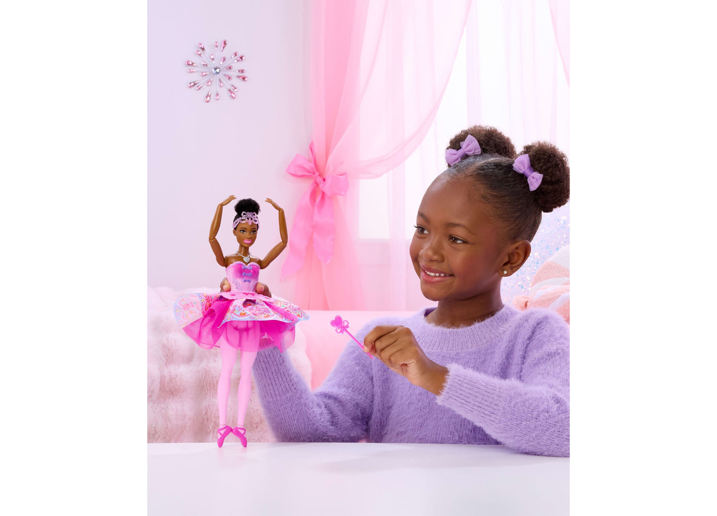 Barbie in the Nutcracker Sugar Plum doll in pink tutu with girl playing