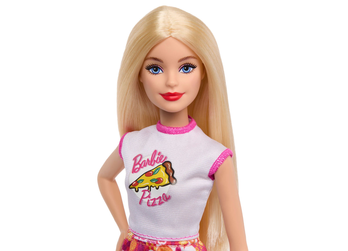Barbie doll with long blonde hair wearing white and pink pizza-themed shirt