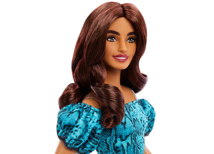 Barbie Fashionistas Style 250 doll with long burgundy curled hair, wearing blue snake-print off-shoulder top