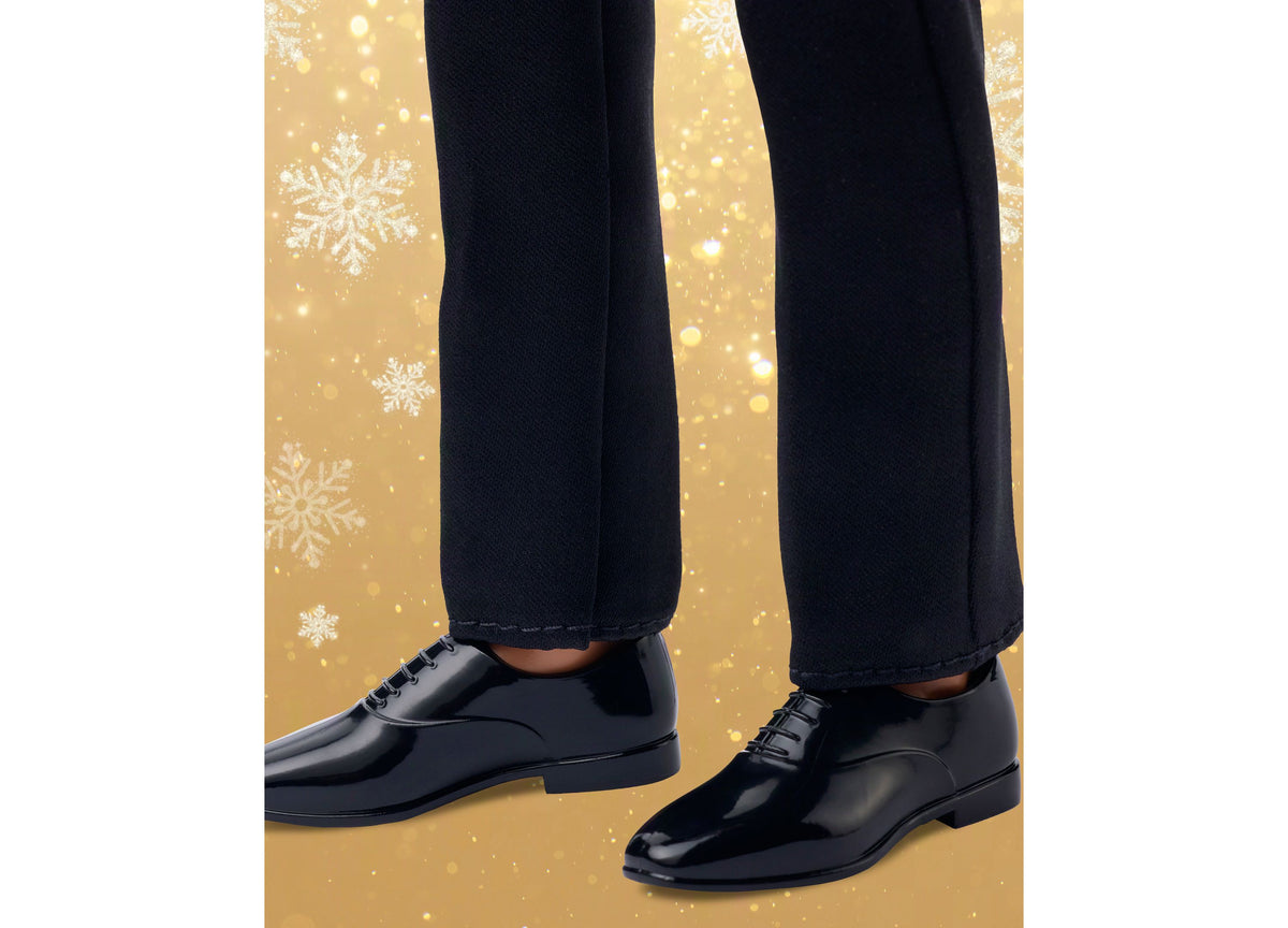 Barbie Signature 2026 Holiday Ken 13-Inch Collectible Fashion Doll wearing black suit and shoes against gold snowflak...